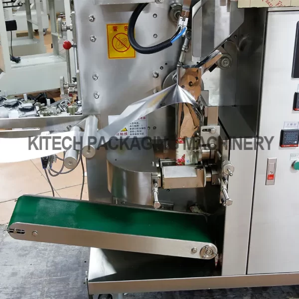 Tea packing machine with touch screen interface and conveyor belt.